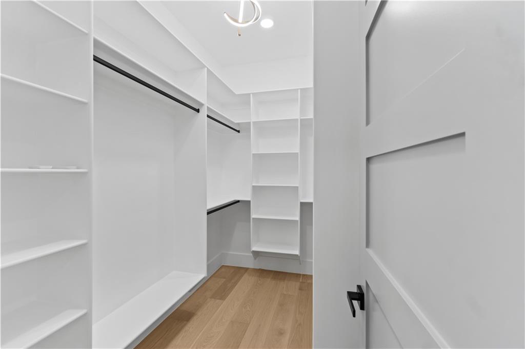 2695 Collins Hill Road Lawrenceville, GA 30043 - Photo 36 of 66 a view of walk in closet with empty racks
