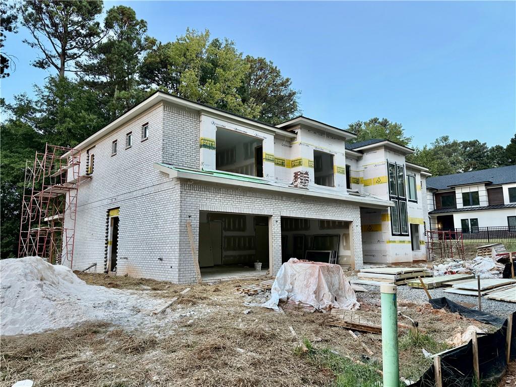 2695 Collins Hill Road Lawrenceville, GA 30043 - Photo 4 of 66 a view of a house with backyard and sitting area
