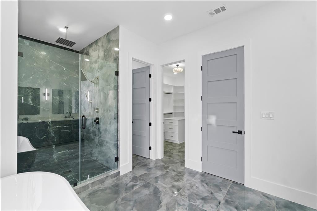 2695 Collins Hill Road Lawrenceville, GA 30043 - Photo 55 of 66 a bathroom with a shower and a sink