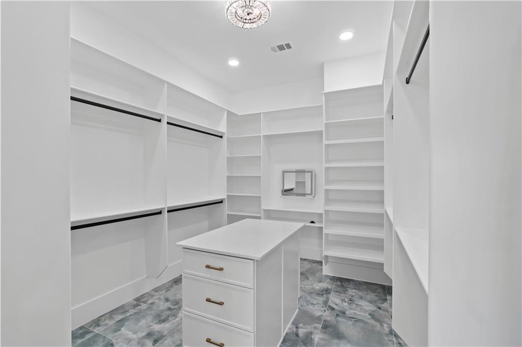 2695 Collins Hill Road Lawrenceville, GA 30043 - Photo 59 of 66 a view of walk in closet with empty racks