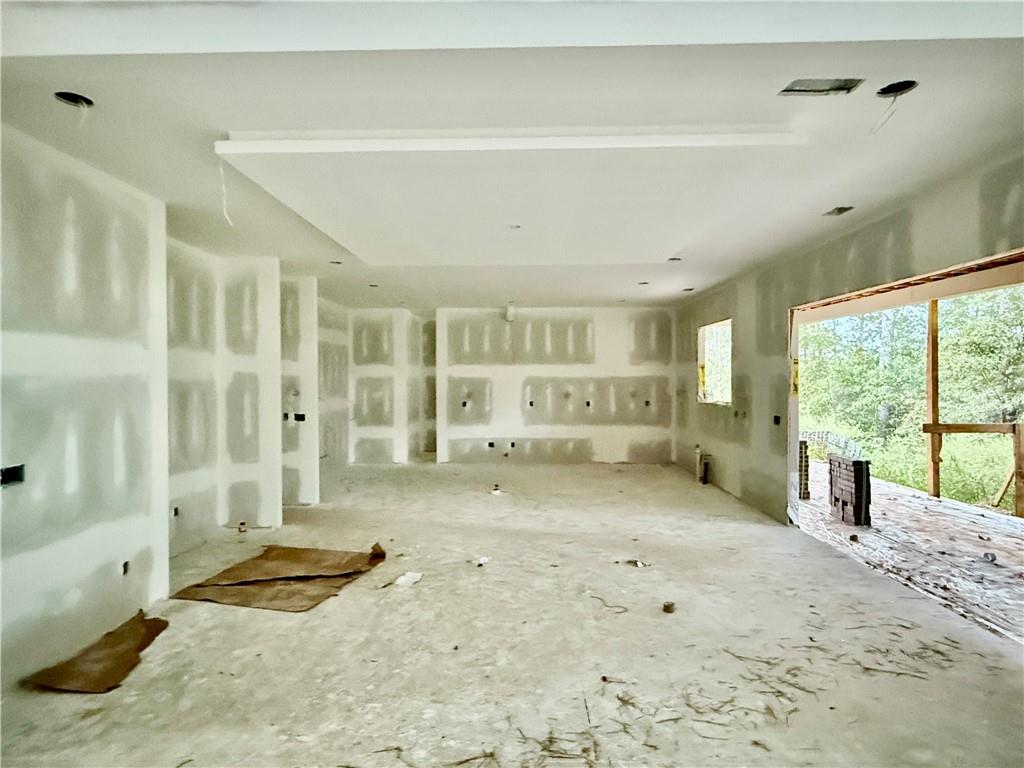2695 Collins Hill Road Lawrenceville, GA 30043 - Photo 6 of 66 a view of a livingroom with wooden floor and a cabinet