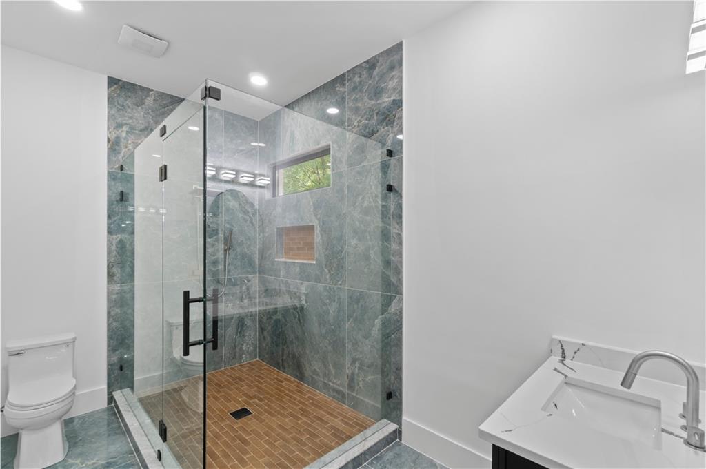 2695 Collins Hill Road Lawrenceville, GA 30043 - Photo 66 of 66 a bathroom with a shower and a toilet