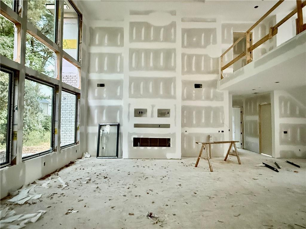 2695 Collins Hill Road Lawrenceville, GA 30043 - Photo 7 of 66 a bedroom with a bed and large windows