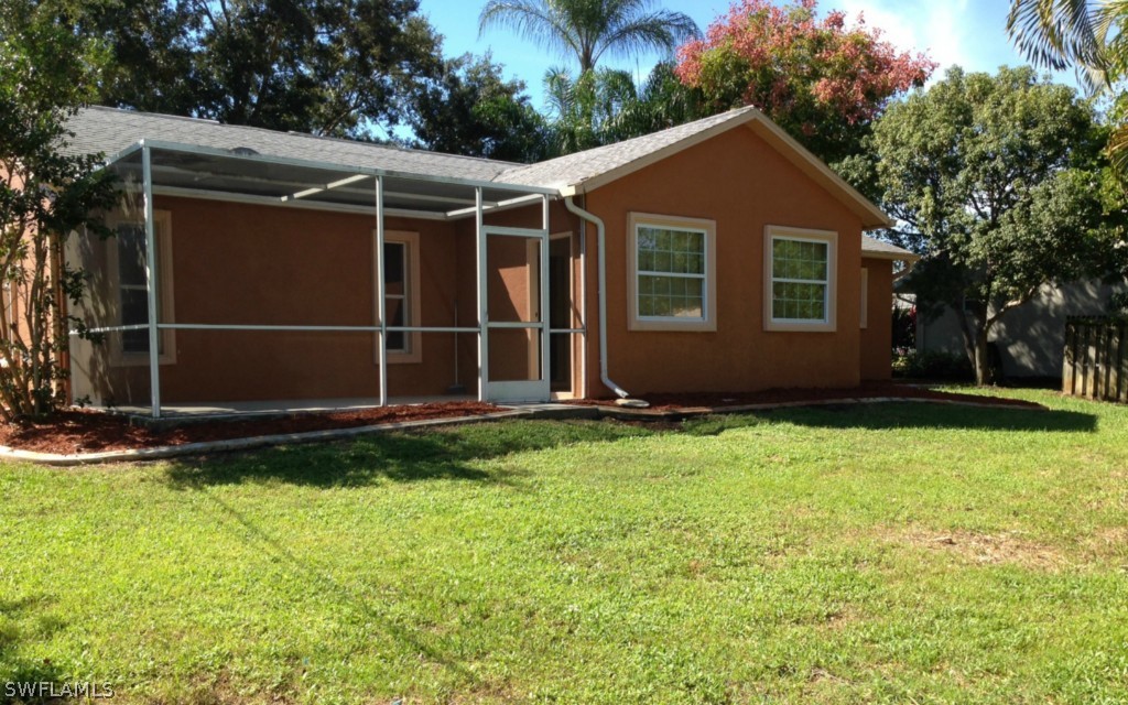 9147 Aster Road Fort Myers, FL 33967 - Photo 3 of 20 a view of house with backyard