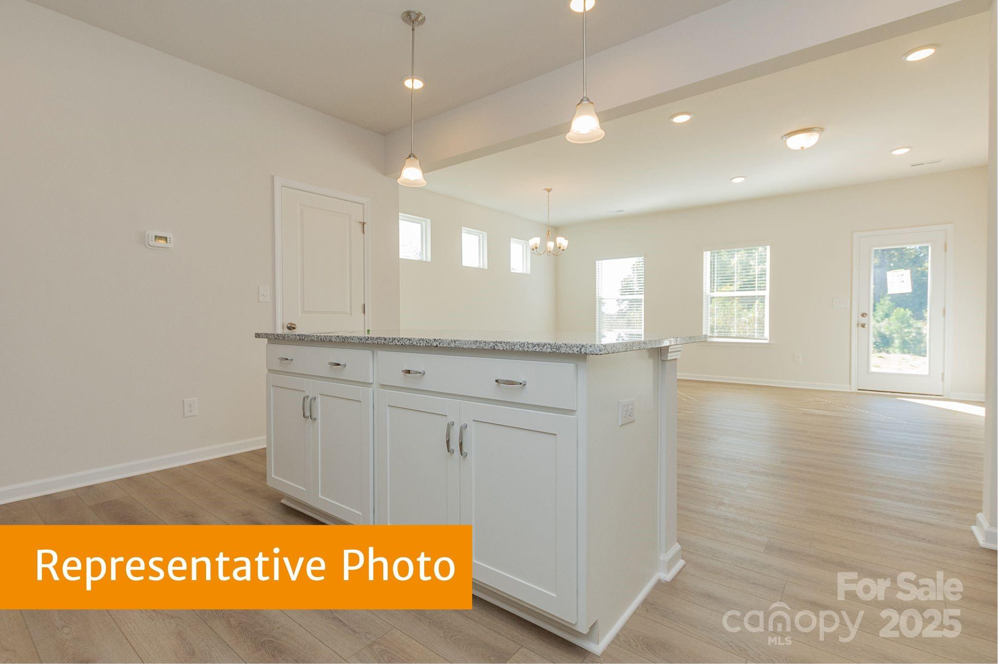 6037 Jasmine Br Road Charlotte, NC 28216 - Photo 8 of 33 a view of an empty room and window