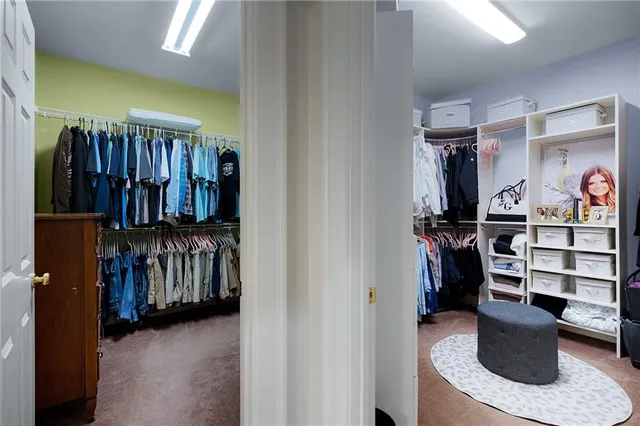 a kitchen with stainless steel appliances granite countertop a stove refrigerator and cabinets