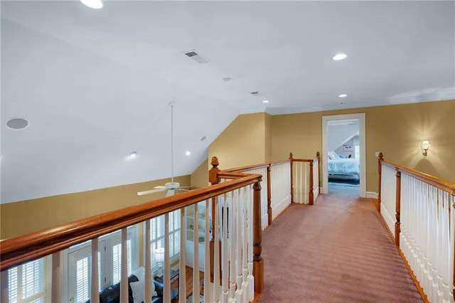 a view of a livingroom with wooden floor and flat screen tv