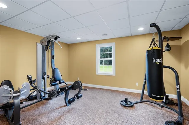 a kitchen with stainless steel appliances granite countertop a sink dishwasher stove and cabinets with wooden floor