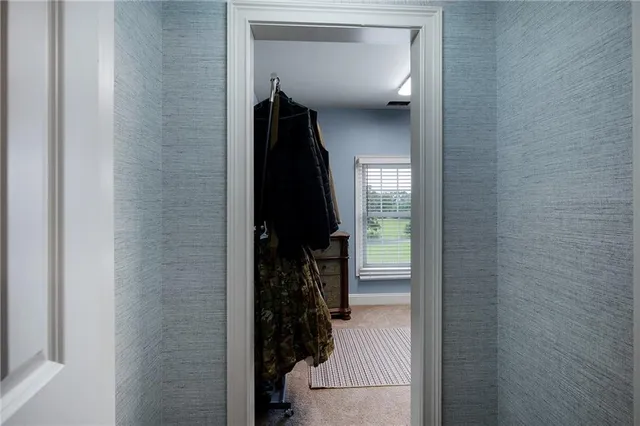 a bedroom with a bed and a mirror