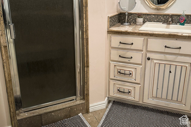 2855 South 1000 West Perry, UT 84302 - Photo 87 of 142 ADU - Master Bathroom with vanity, tiled floors, a stall shower, and decorative backsplash