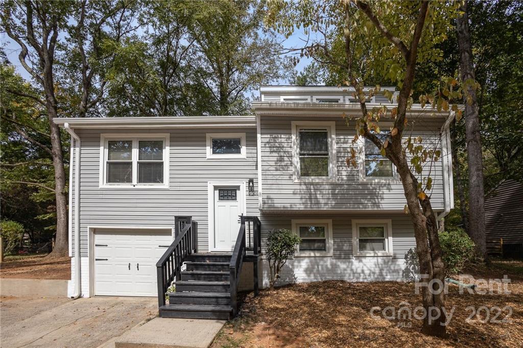 9501 Fairway Ridge Road Charlotte, NC 28277 - Photo 1 of 26 a front view of house with stairs and trees