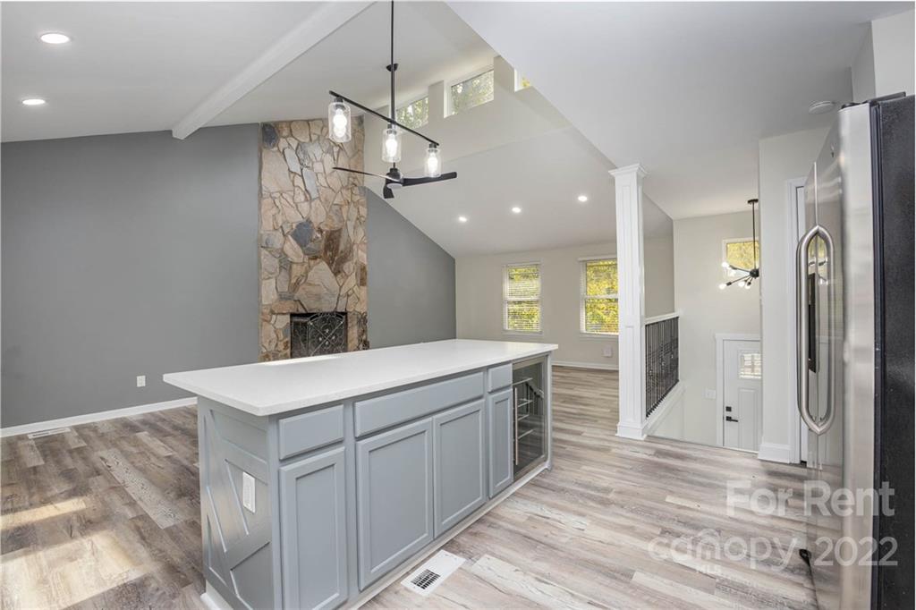 9501 Fairway Ridge Road Charlotte, NC 28277 - Photo 13 of 26 a kitchen with a sink a counter top space stainless steel appliances and a chandelier