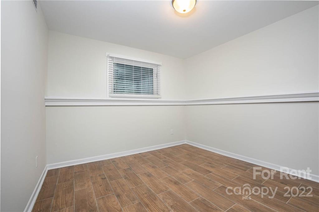 9501 Fairway Ridge Road Charlotte, NC 28277 - Photo 19 of 26 a view of a room with wooden floor and fan