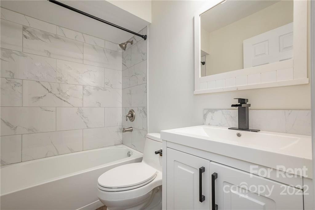 9501 Fairway Ridge Road Charlotte, NC 28277 - Photo 22 of 26 a bathroom with a sink a toilet and shower