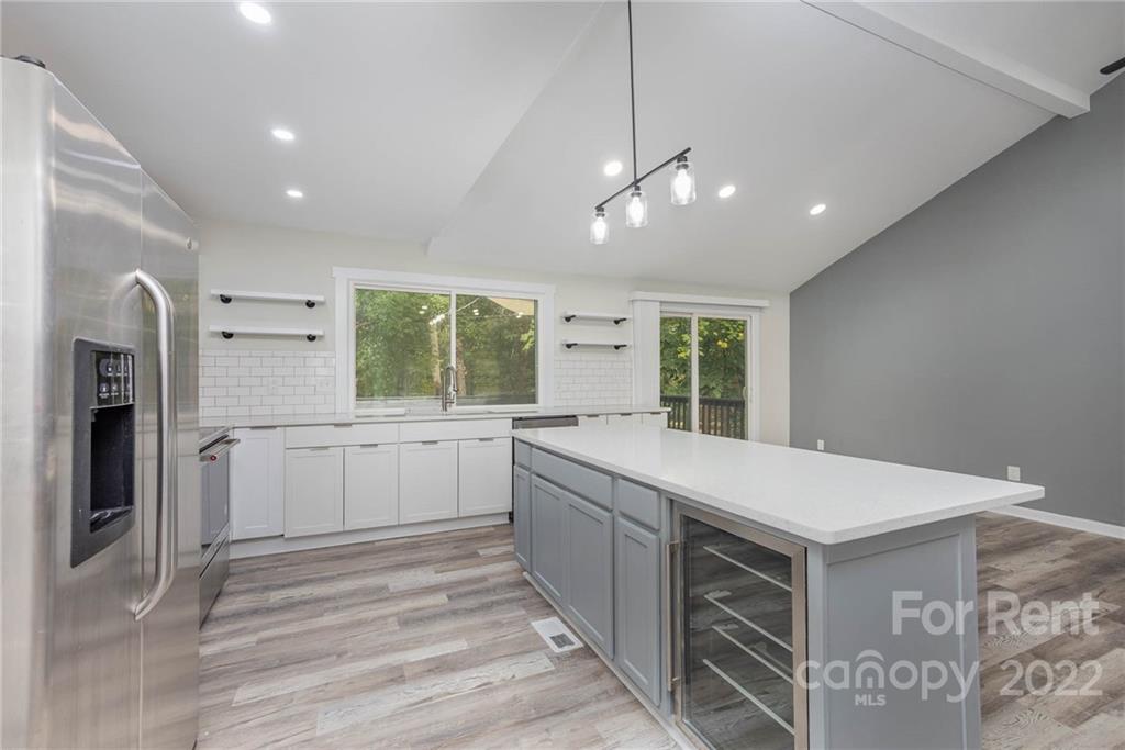 9501 Fairway Ridge Road Charlotte, NC 28277 - Photo 23 of 26 a kitchen with a stove a sink and a refrigerator
