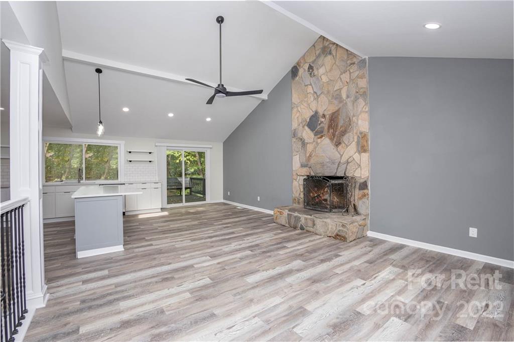 9501 Fairway Ridge Road Charlotte, NC 28277 - Photo 8 of 26 a view of a room with a fireplace and wooden floor