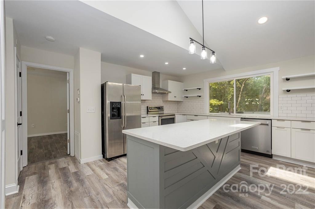 9501 Fairway Ridge Road Charlotte, NC 28277 - Photo 10 of 26 a large white kitchen with a large window a refrigerator and a sink