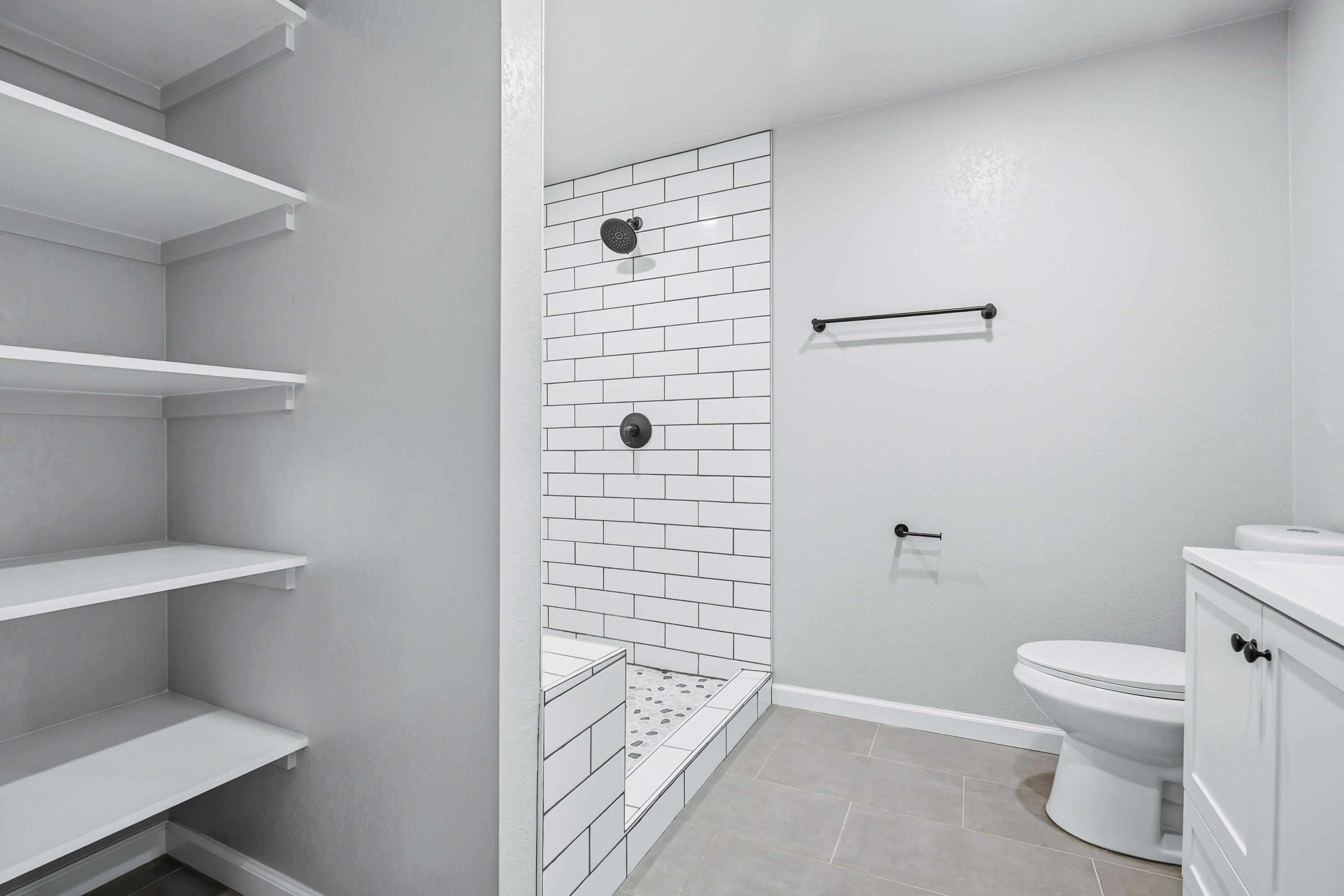 6673 Mountain View Drive Anderson, CA 96007 - Photo 20 of 42 a bathroom with a toilet and a shower