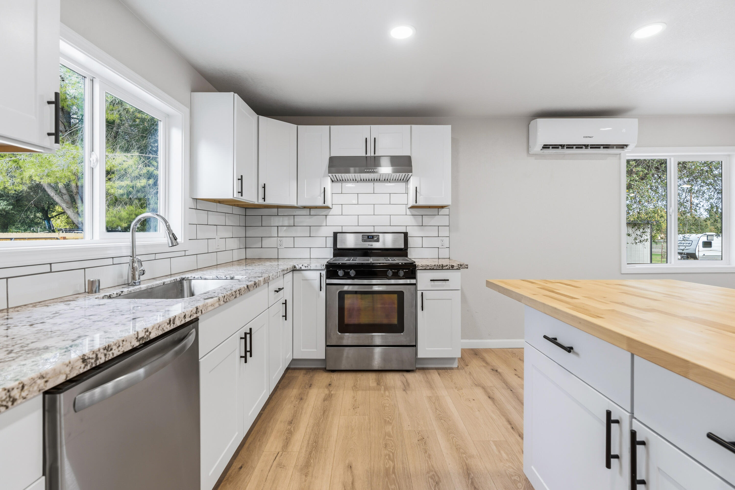 6673 Mountain View Drive Anderson, CA 96007 - Photo 26 of 42 a kitchen with stainless steel appliances granite countertop a stove and a sink