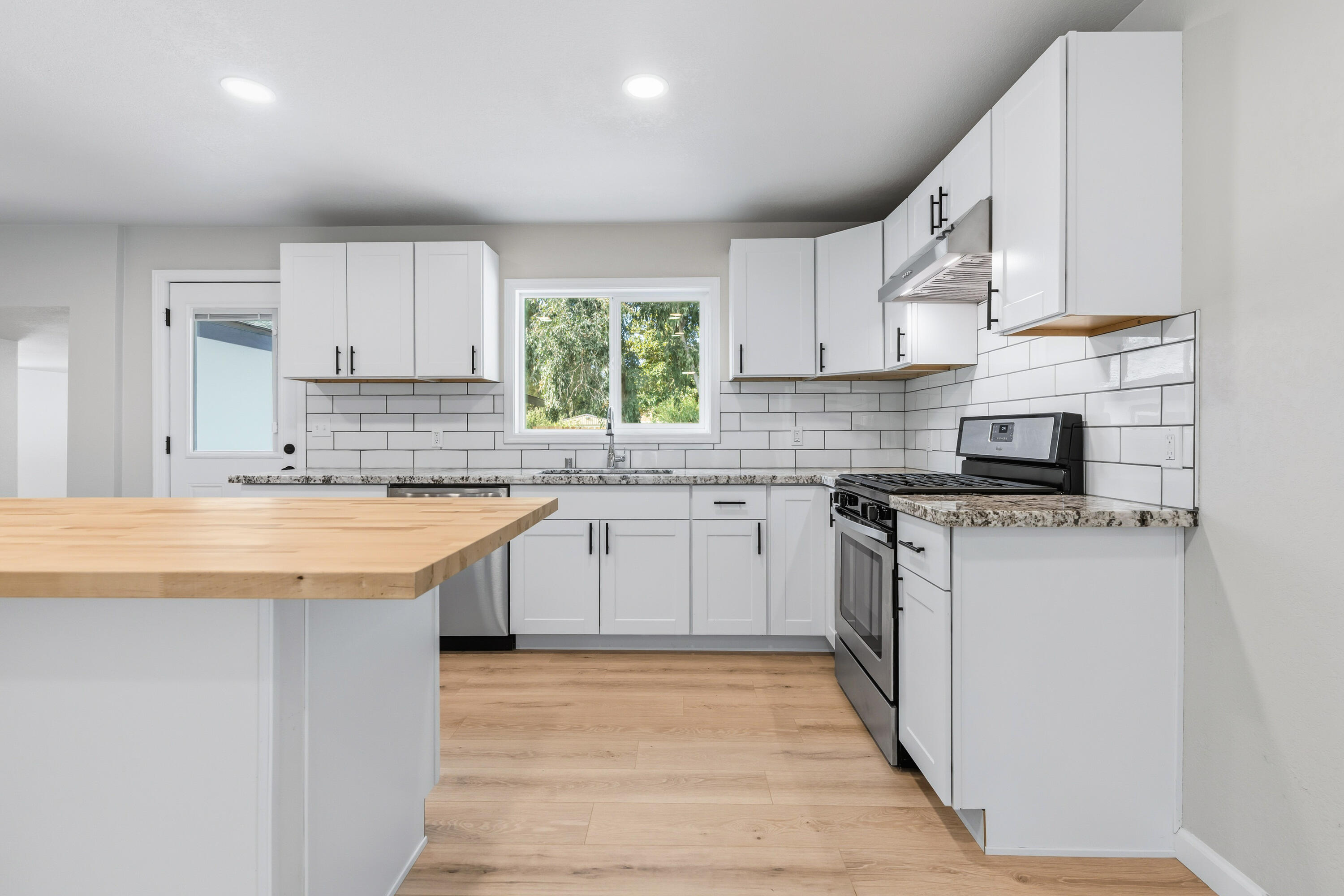 6673 Mountain View Drive Anderson, CA 96007 - Photo 27 of 42 a kitchen with a sink stove and cabinets