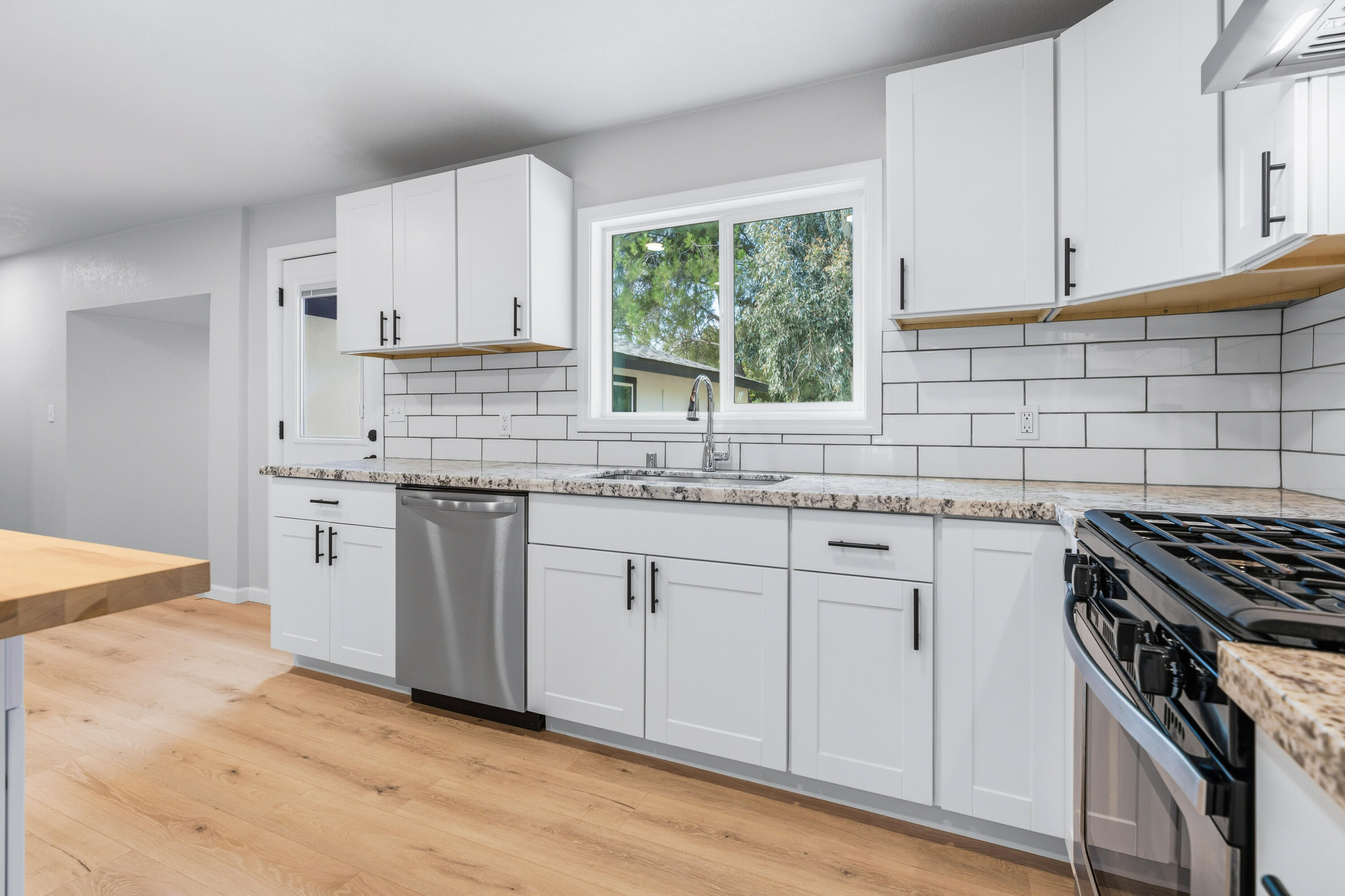 6673 Mountain View Drive Anderson, CA 96007 - Photo 28 of 42 a kitchen with white cabinets sink and appliances