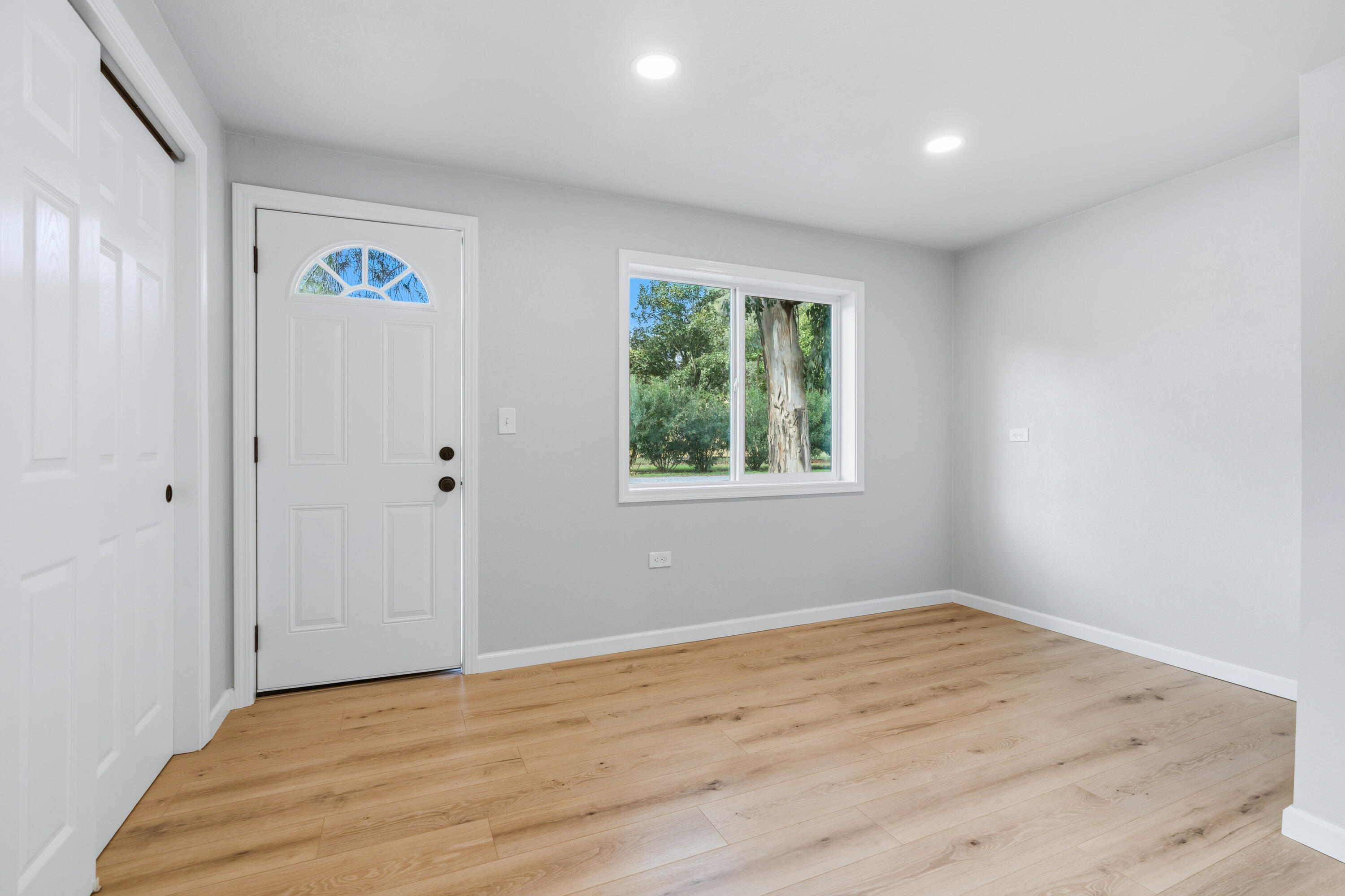 6673 Mountain View Drive Anderson, CA 96007 - Photo 5 of 42 a view of an empty room with wooden floor and window