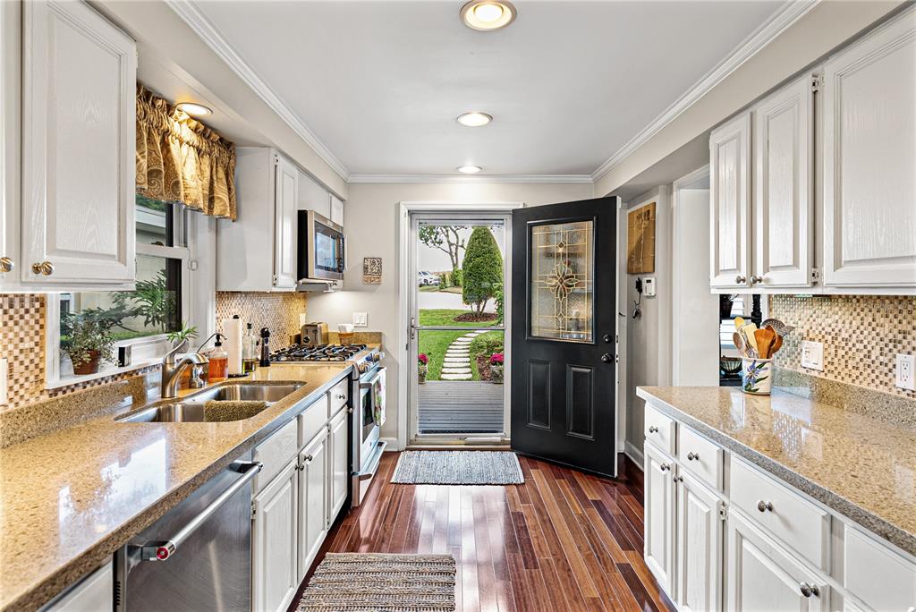 1075 Cody Cove Road Babson Park, FL 33827 - Photo 13 of 96 a kitchen with granite countertop a sink a counter top space and stainless steel appliances