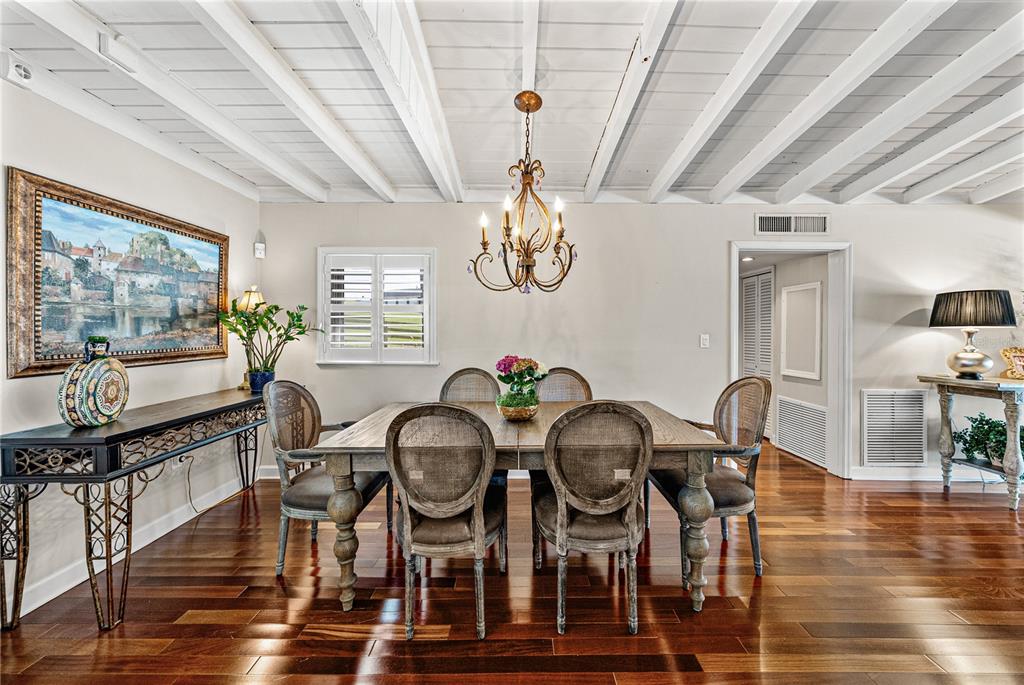 1075 Cody Cove Road Babson Park, FL 33827 - Photo 16 of 96 a view of a dining room with furniture and wooden floor