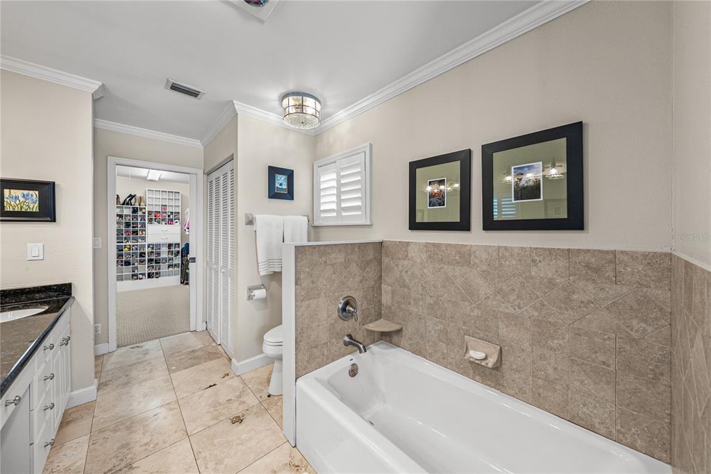 1075 Cody Cove Road Babson Park, FL 33827 - Photo 32 of 96 a bathroom with a bathtub and a shower