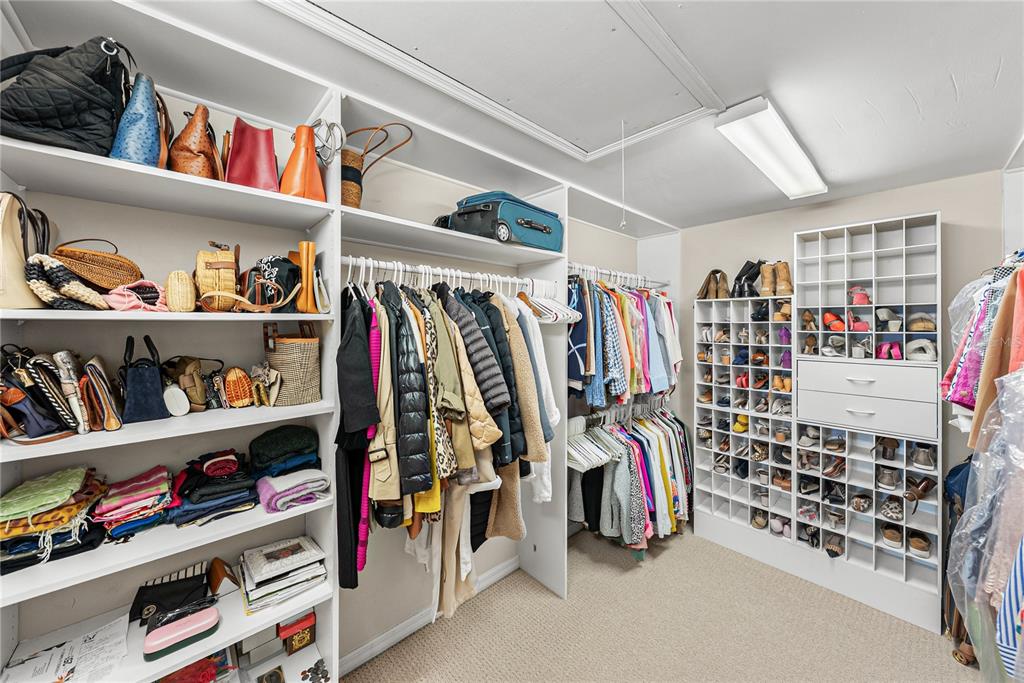 1075 Cody Cove Road Babson Park, FL 33827 - Photo 35 of 96 a view of walk in closet with clothes and shoes