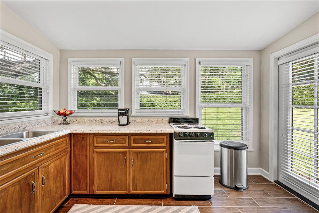 1075 Cody Cove Road Babson Park, FL 33827 - Photo 50 of 96 a kitchen with a stove and a sink
