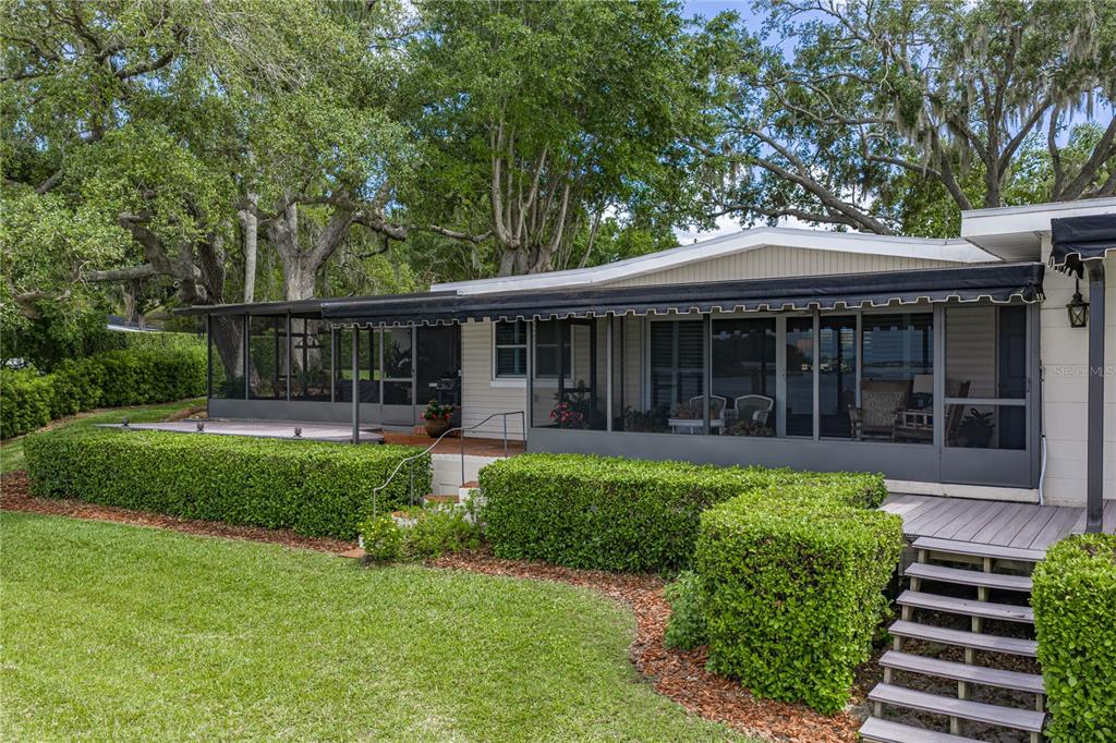 1075 Cody Cove Road Babson Park, FL 33827 - Photo 67 of 96 a view of a house with a yard and a garden