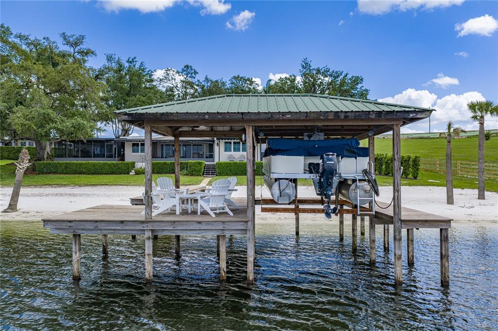 1075 Cody Cove Road Babson Park, FL 33827 - Photo 80 of 96 a view of a chairs and table in the patio and a fountain