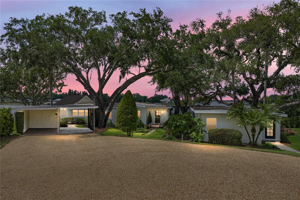 1075 Cody Cove Road Babson Park, FL 33827 - Photo 92 of 96 a front view of a house with a garden and tree