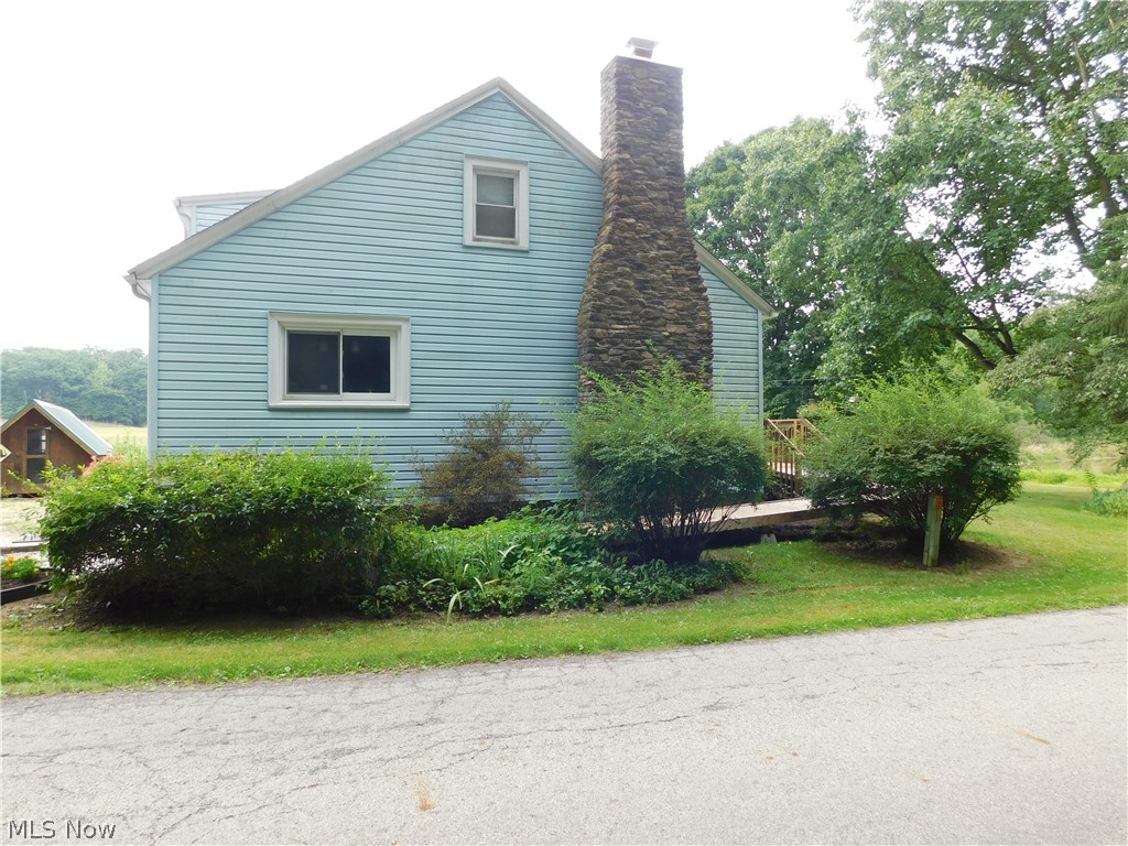 5531 Overton Road Wooster, OH 44691 - Photo 7 of 40 View of side of property with a lawn