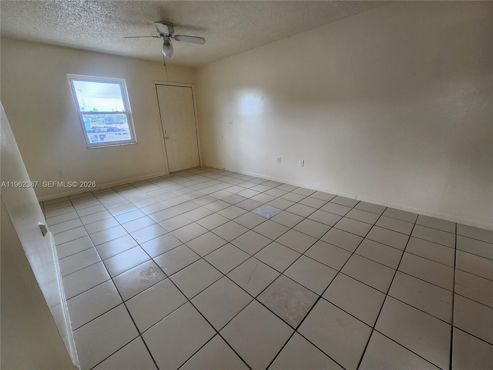 4131 Commercial Drive Sebring, FL 33870 - Photo 11 of 20 an empty room with windows