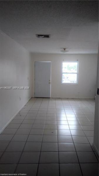 4131 Commercial Drive Sebring, FL 33870 - Photo 14 of 20 an empty room with windows