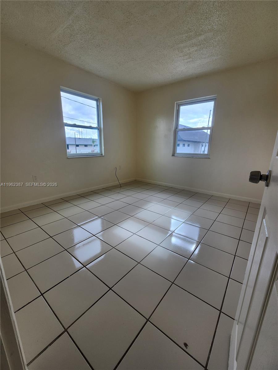 4131 Commercial Drive Sebring, FL 33870 - Photo 6 of 20 a view of an empty room and a window