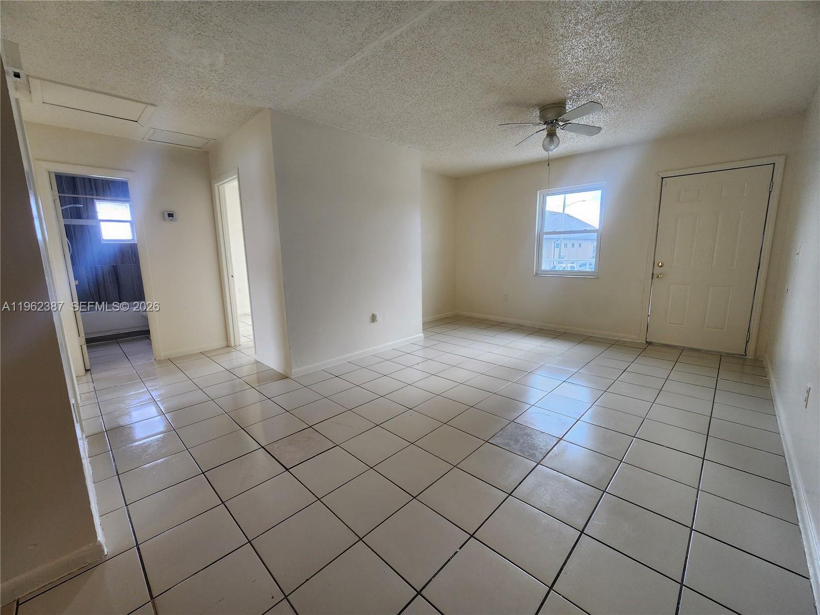 4131 Commercial Drive Sebring, FL 33870 - Photo 7 of 20 a view of an empty room and window