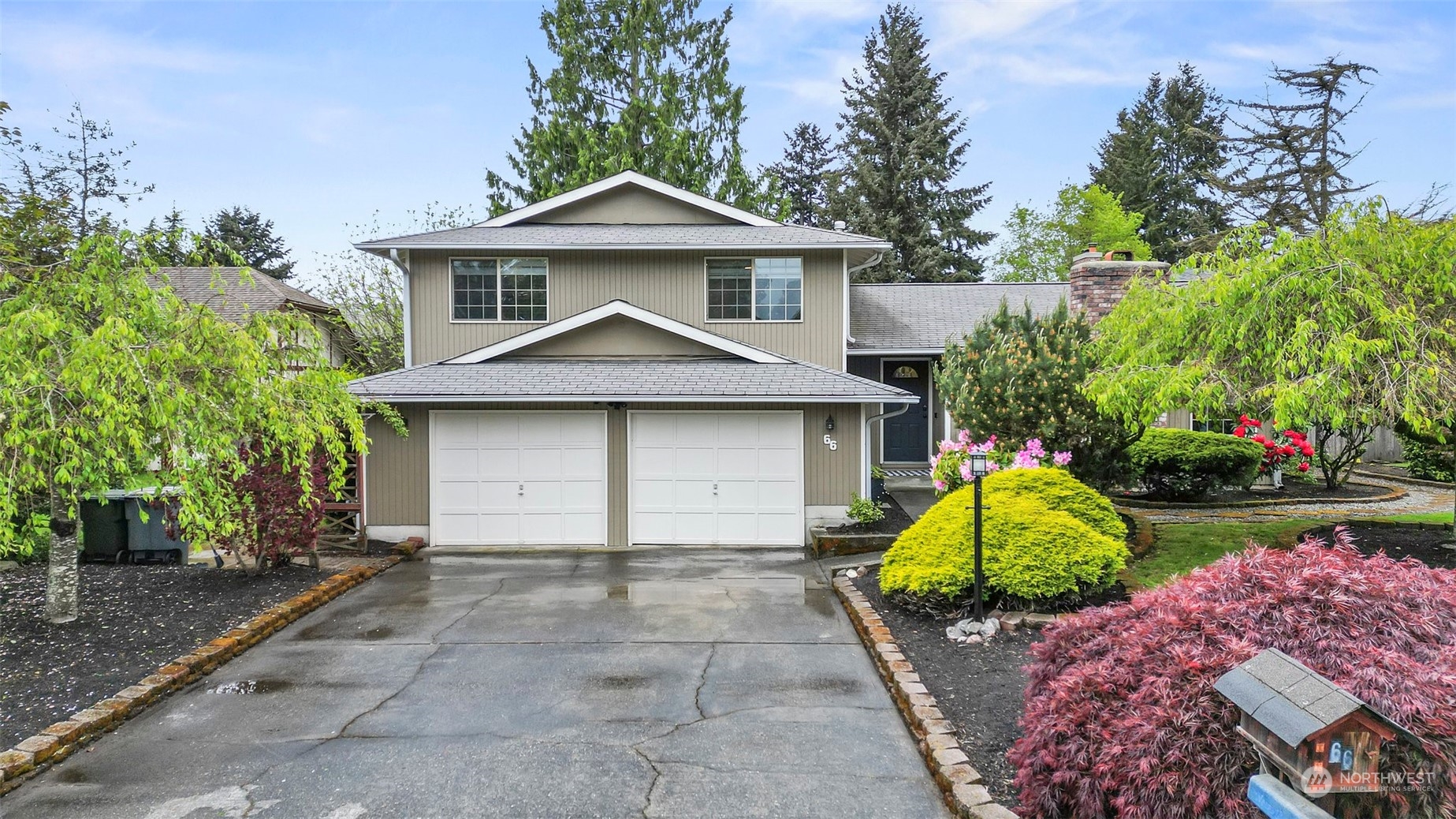 66 Bonney Street Steilacoom, WA 98388 - Photo 1 of 40 a front view of a house with a garden