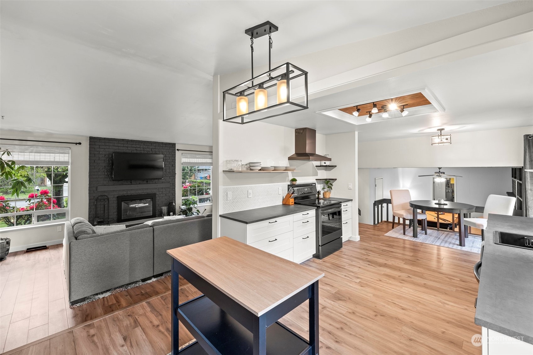 66 Bonney Street Steilacoom, WA 98388 - Photo 11 of 40 a kitchen with sink a refrigerator and chairs