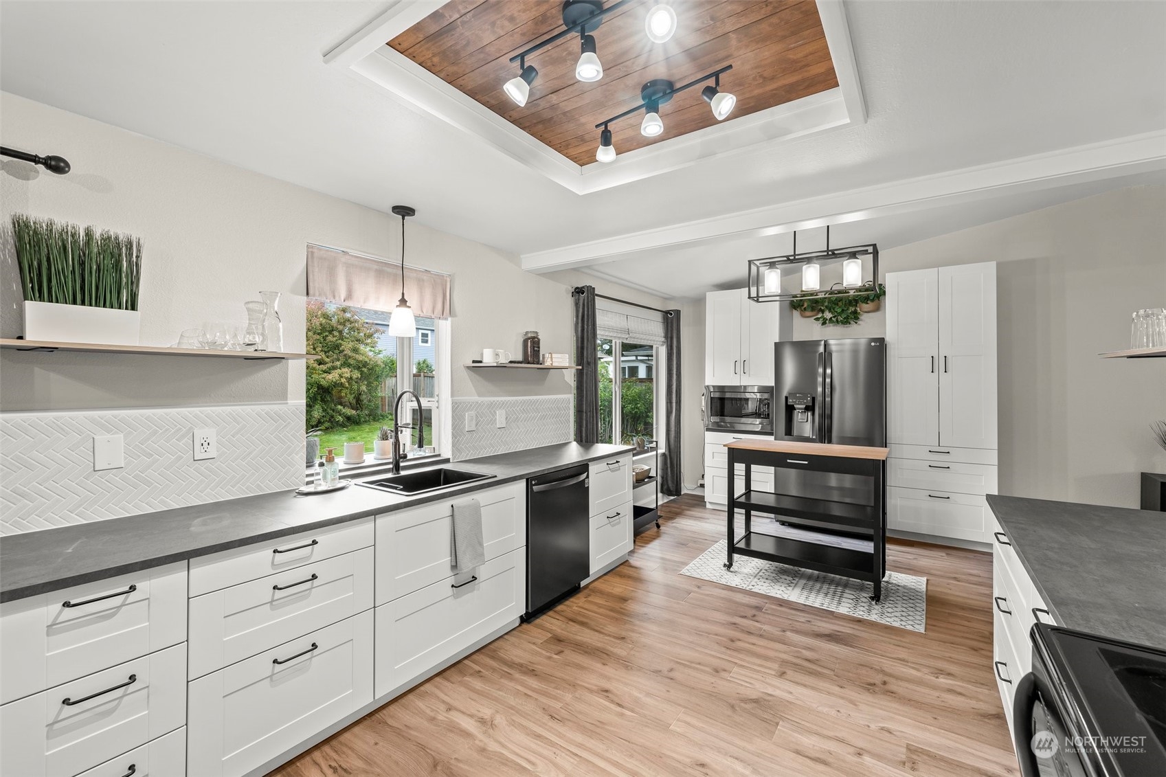 66 Bonney Street Steilacoom, WA 98388 - Photo 13 of 40 a large white kitchen with stainless steel appliances