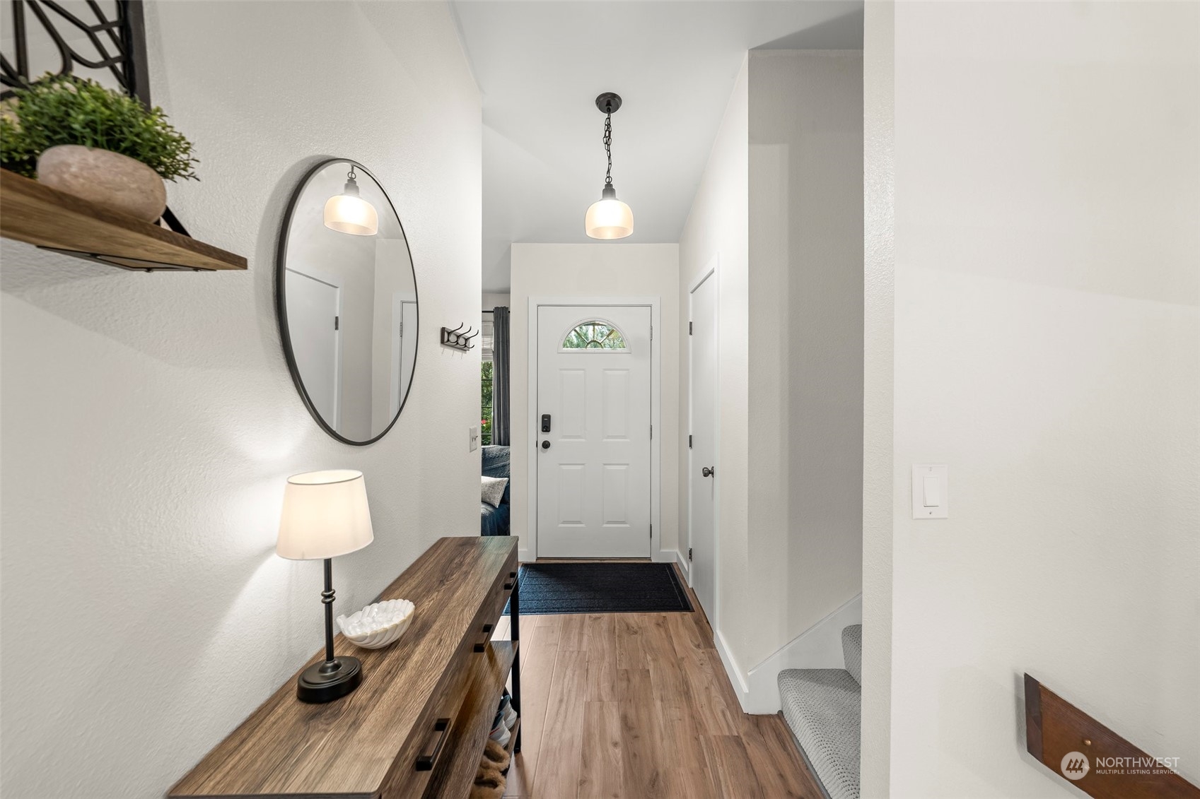 66 Bonney Street Steilacoom, WA 98388 - Photo 20 of 40 a view of a hallway with wooden floor and a bathroom