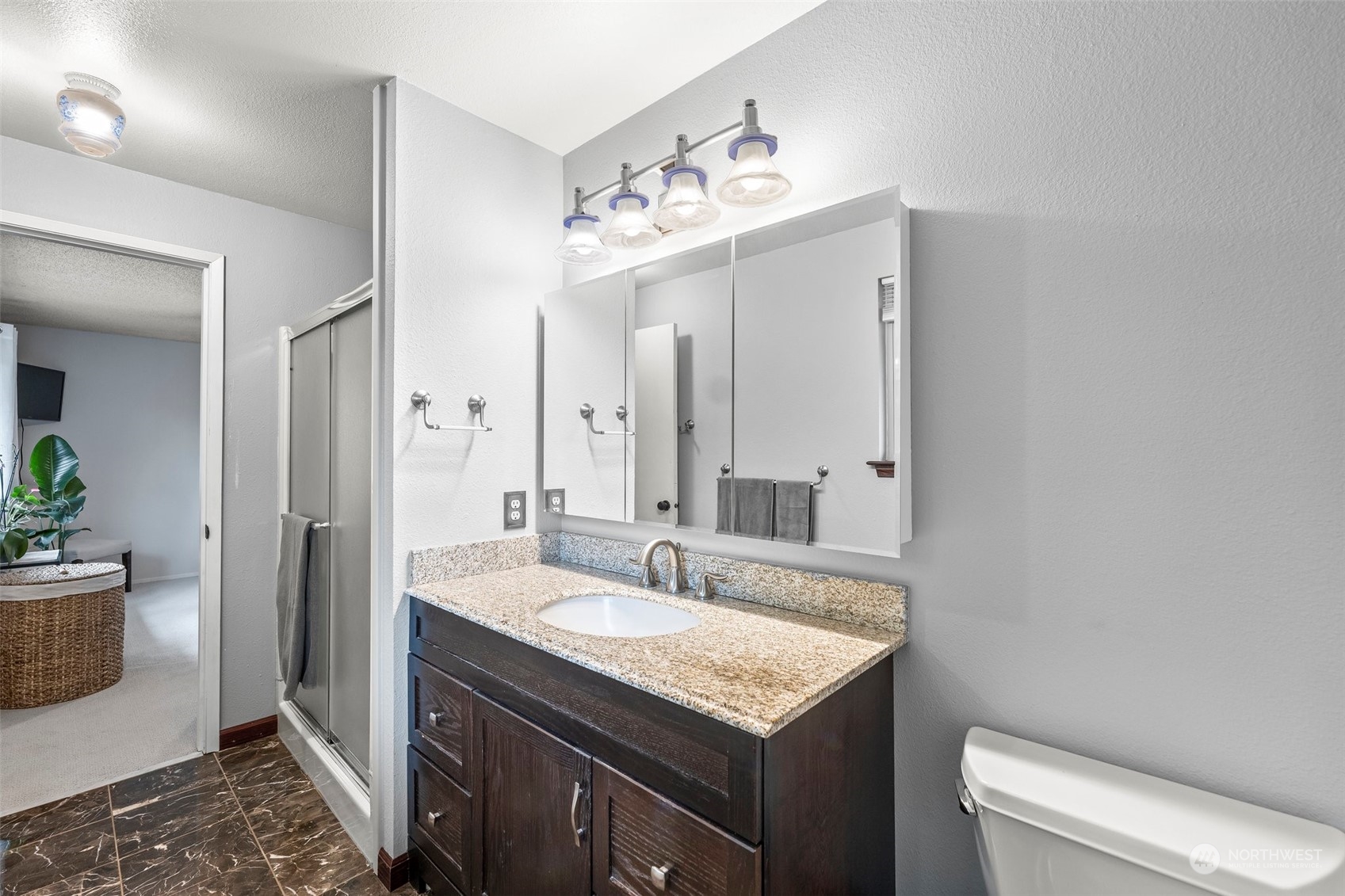 66 Bonney Street Steilacoom, WA 98388 - Photo 25 of 40 a spacious bathroom with a granite countertop sink and a mirror
