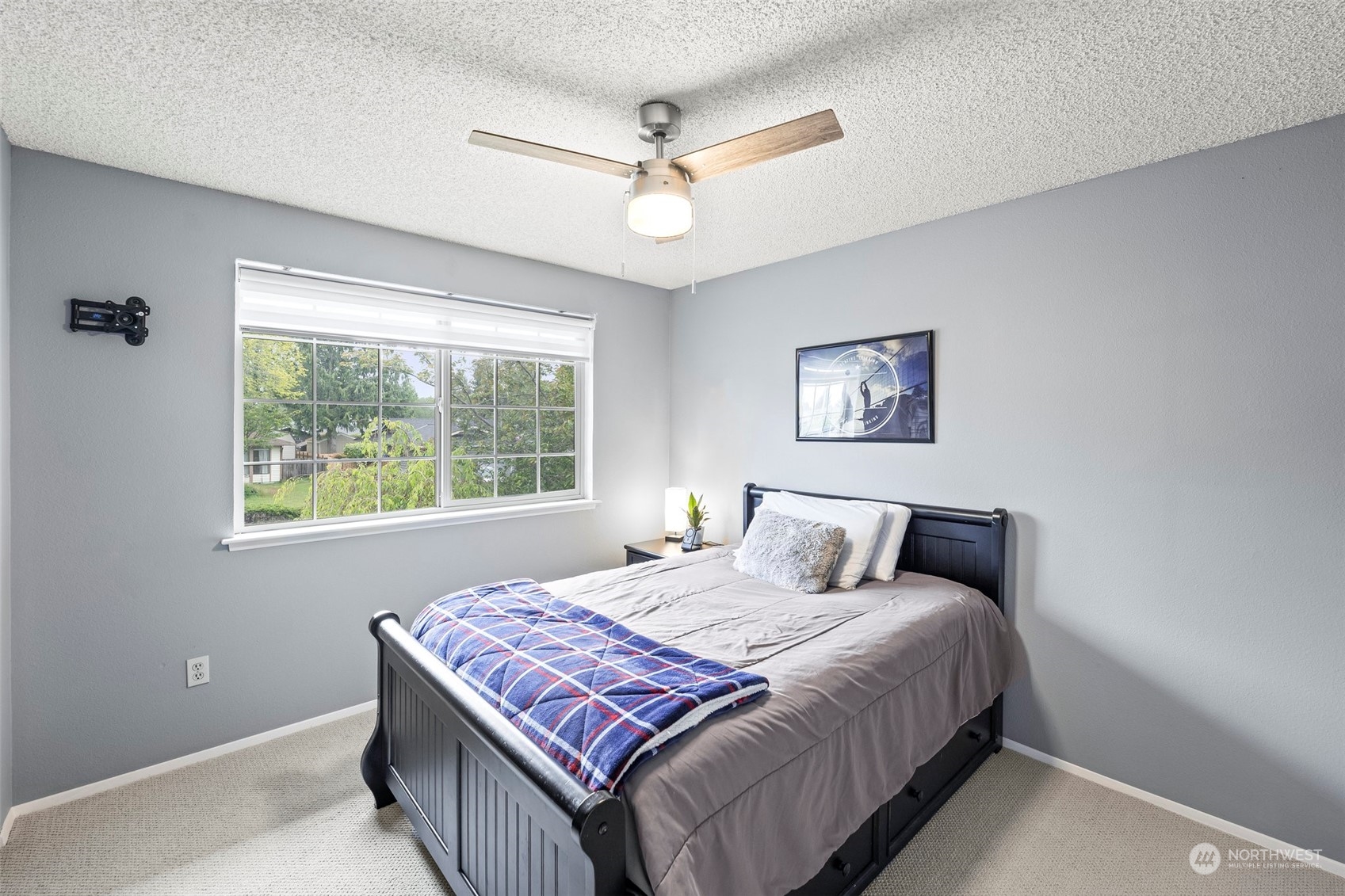 66 Bonney Street Steilacoom, WA 98388 - Photo 26 of 40 a bedroom with a large bed and a window