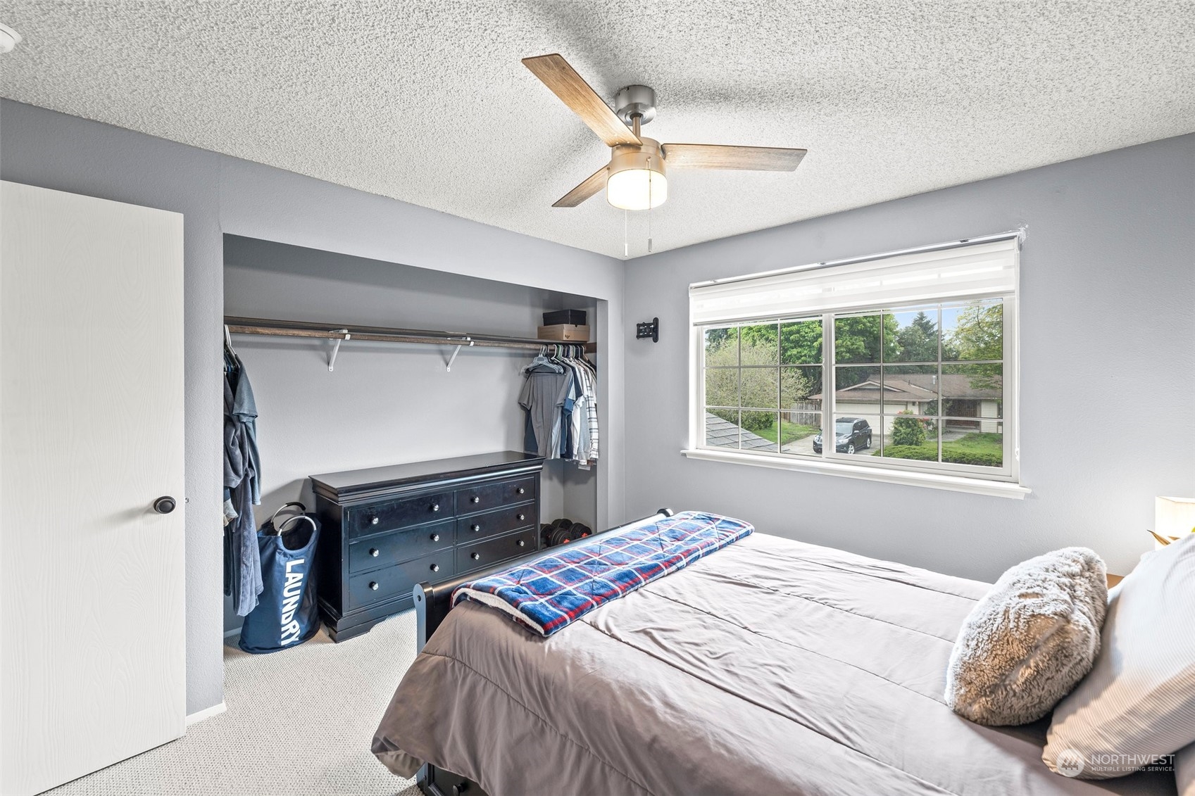 66 Bonney Street Steilacoom, WA 98388 - Photo 27 of 40 a bedroom with a bed and a window