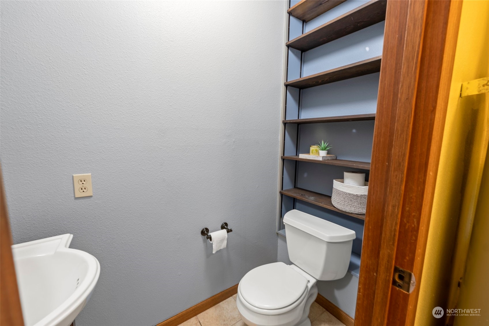 66 Bonney Street Steilacoom, WA 98388 - Photo 30 of 40 a white toilet sitting next to a bathroom sink