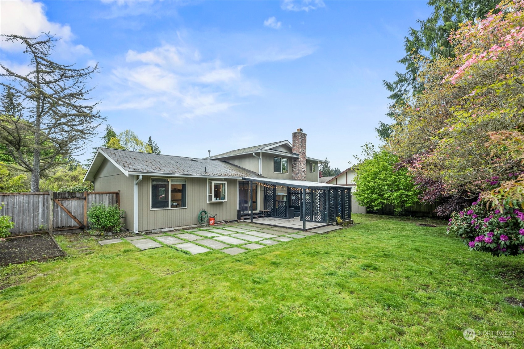 66 Bonney Street Steilacoom, WA 98388 - Photo 33 of 40 a view of a house with a yard and sitting area
