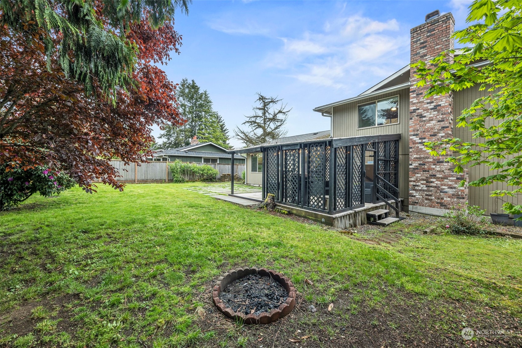 66 Bonney Street Steilacoom, WA 98388 - Photo 35 of 40 a view of backyard with a garden and deck