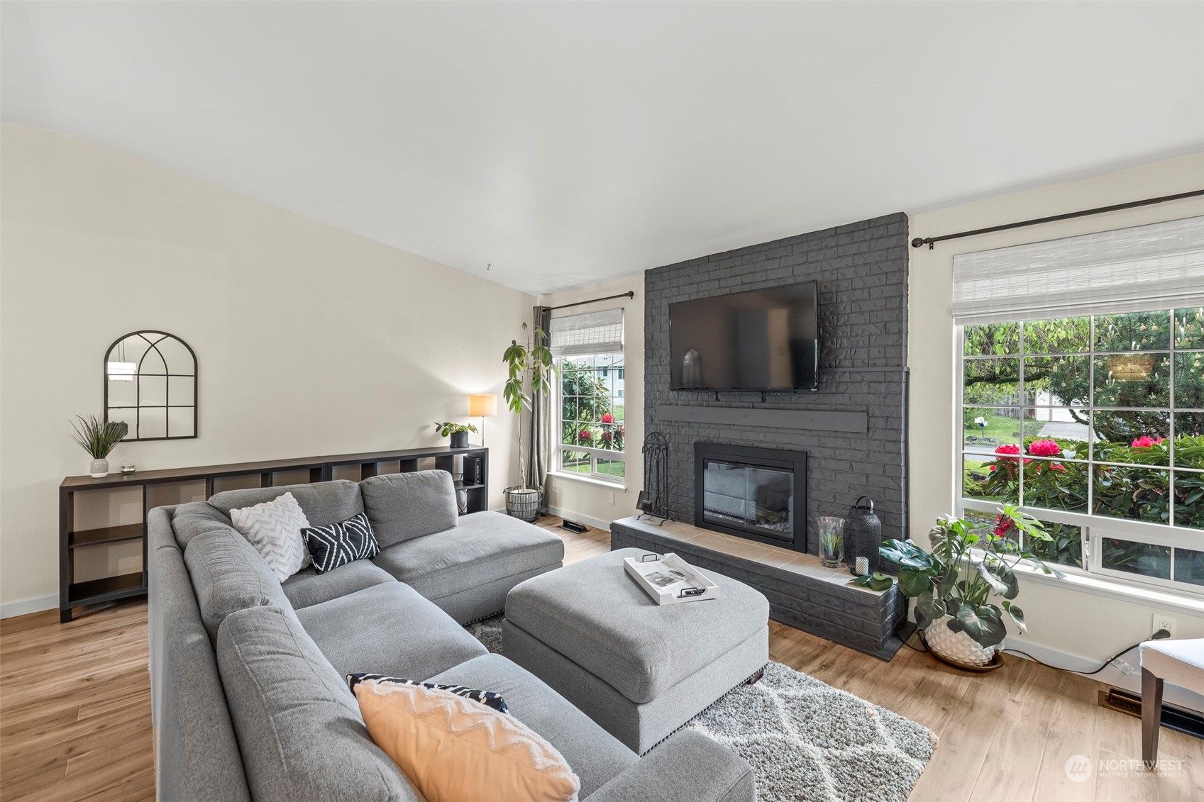 66 Bonney Street Steilacoom, WA 98388 - Photo 6 of 40 a living room with furniture fireplace and a window
